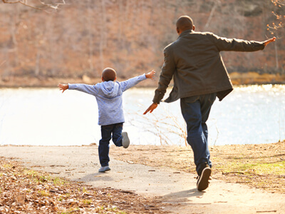 Big Brother and Little running in park