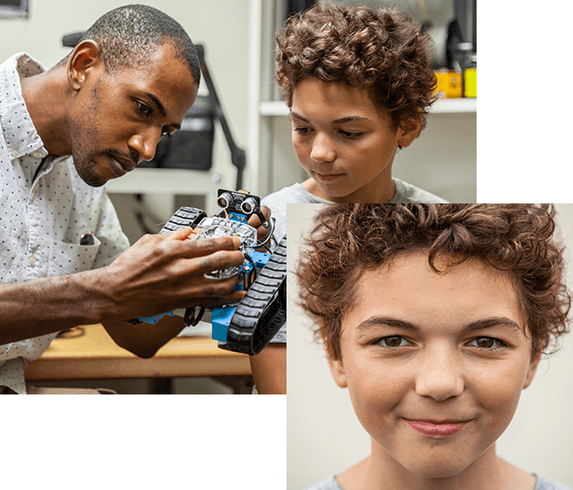 Male Big and Little working on a robot