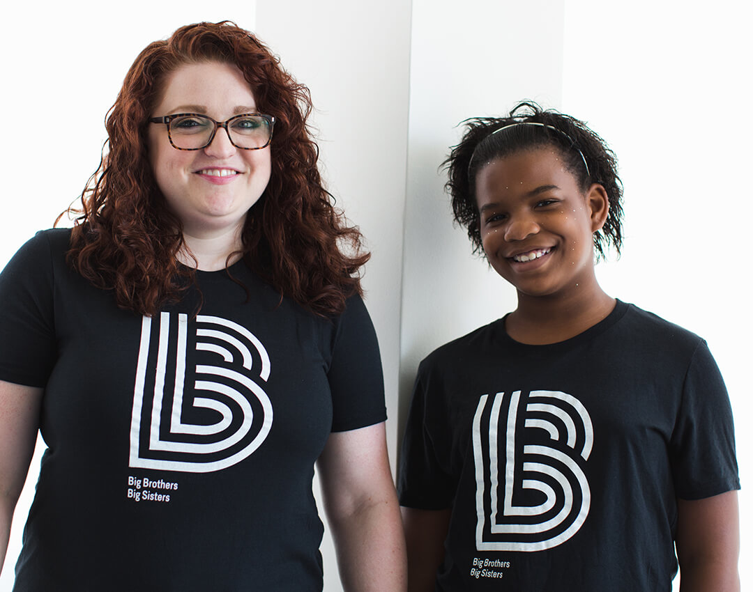 Portrait of female Big and Little in BBBS t-shirts