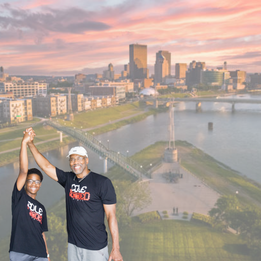 Youth mentor duo standing in front of the Dayton Skyline